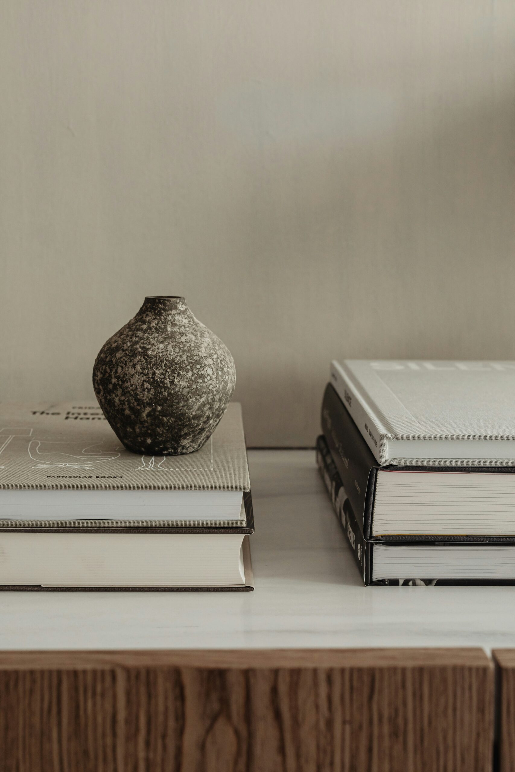 a vase and some books